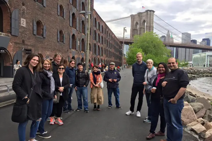 group on tour with buildings in background