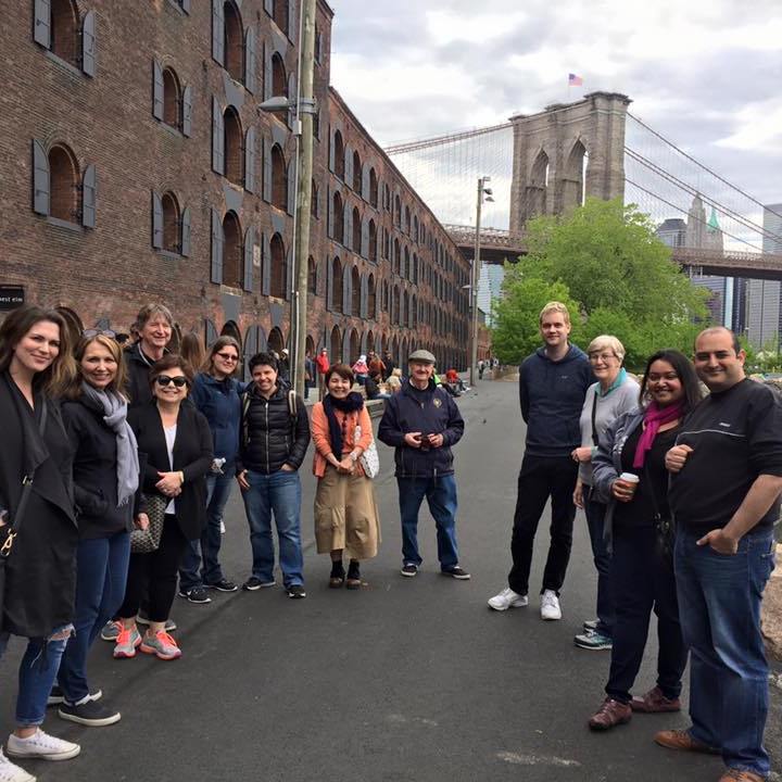 group on tour with buildings in background
