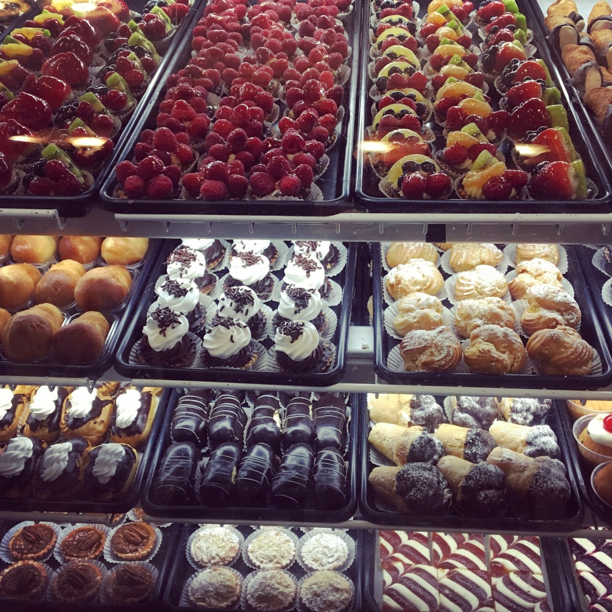 Assorted golden pastries displayed on a tray, highlighting the artisanal baked goods featured on the Brooklyn Food & Culture Tour.